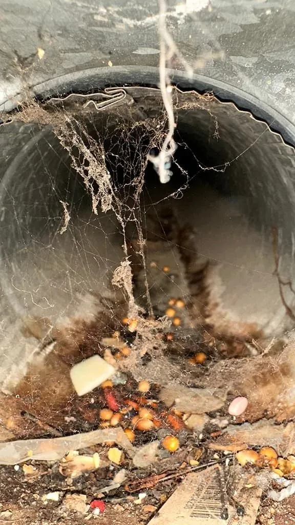 Dirty metal air duct before cleaning