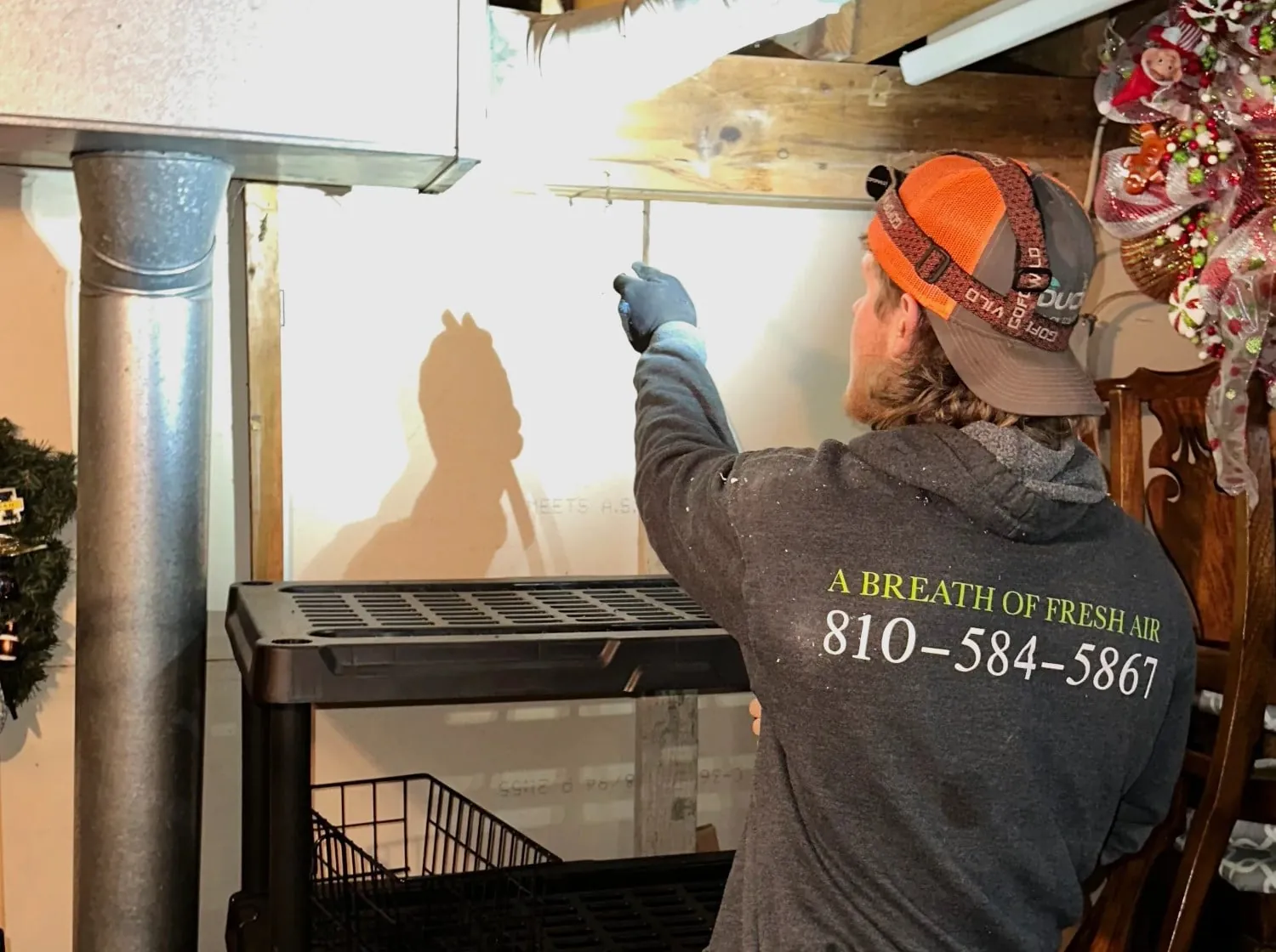 Inspecting basement ductwork in Burton