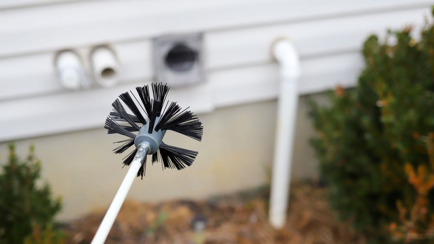 Use a dryer vent brush to clean the interior.